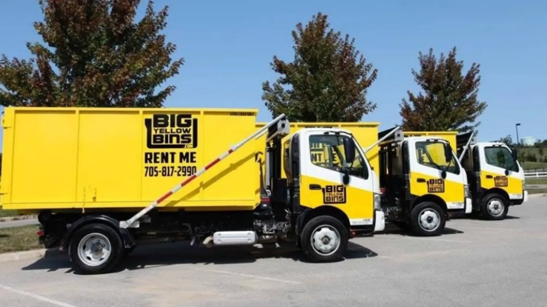 Big Yellow Bins roll-off trucks and yellow dumpsters at the Barrie yard