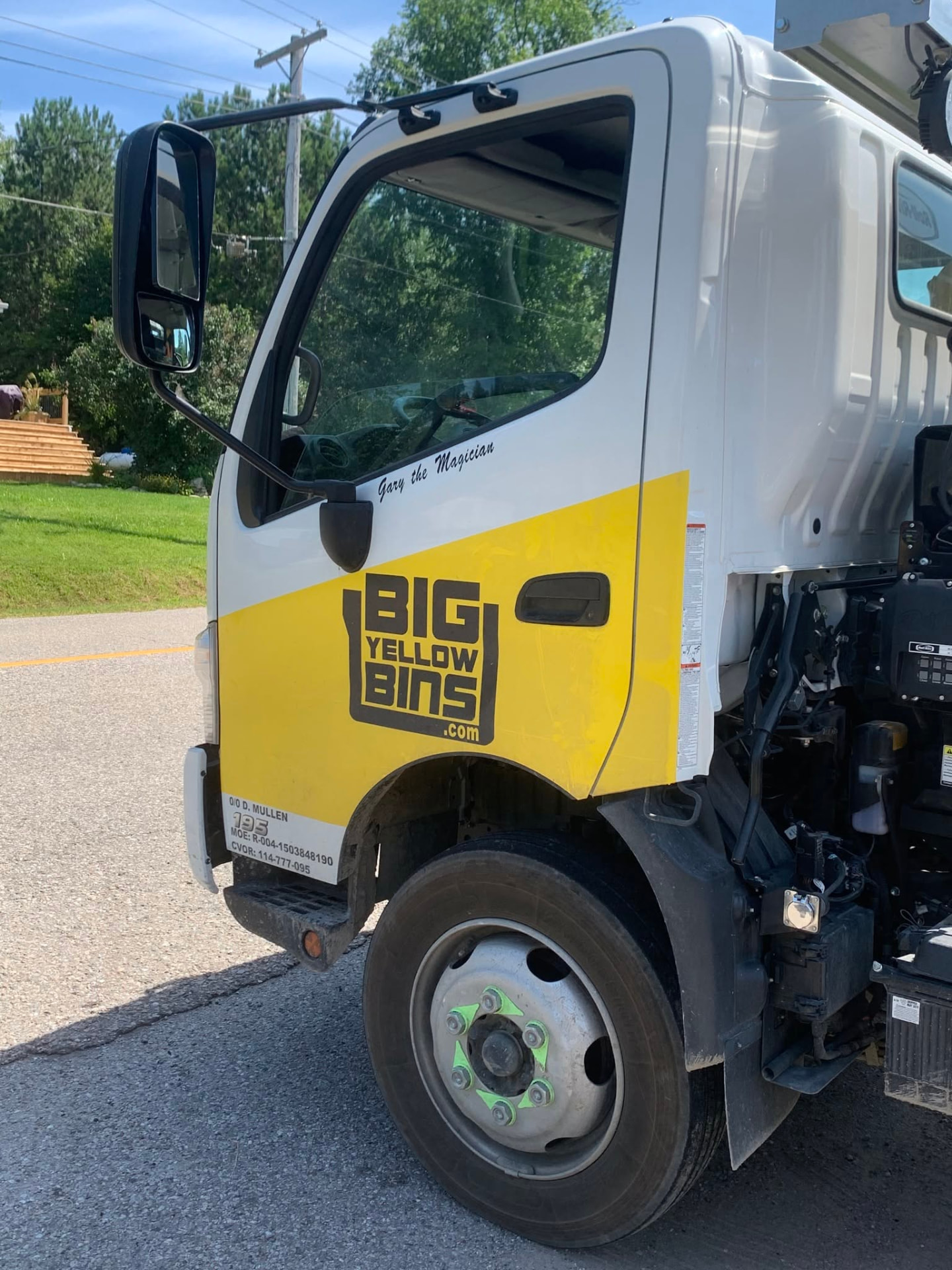 Big Yellow Bins delivery truck serving a local neighbourhood in Orillia, Ontario