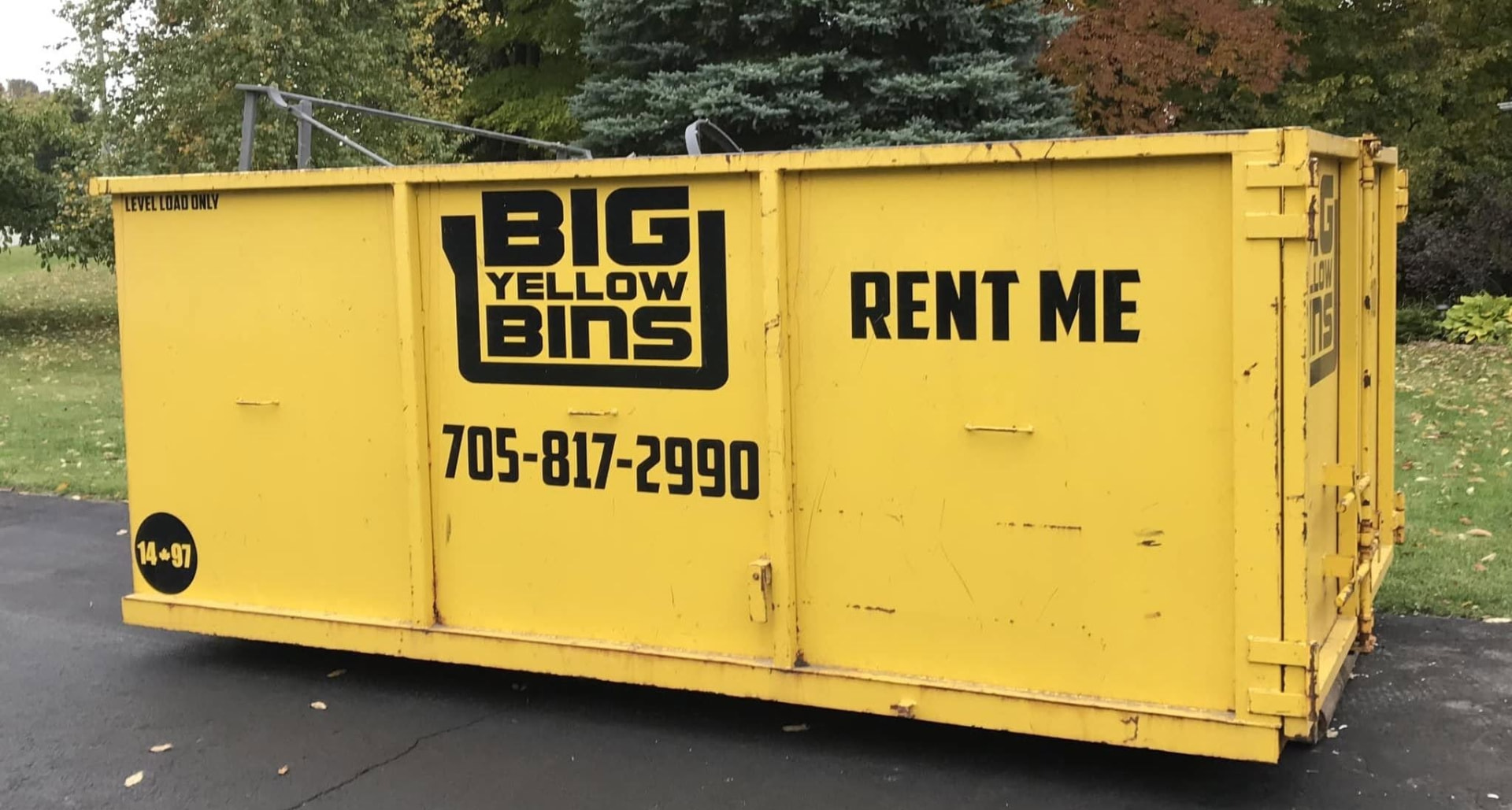 Big Yellow Bins roll off dumpster on a protected driveway in Angus, Ontario