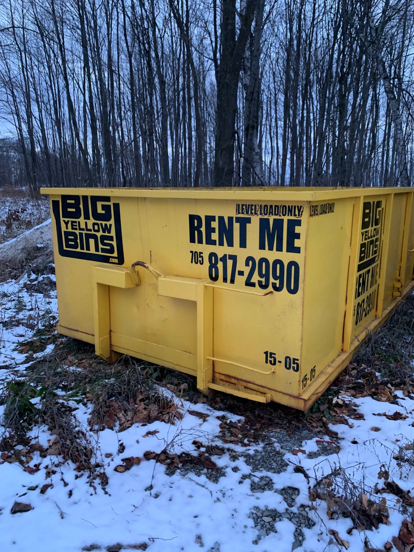 Big Yellow Bins dumpster placed at a winter job site in Alliston, Ontario