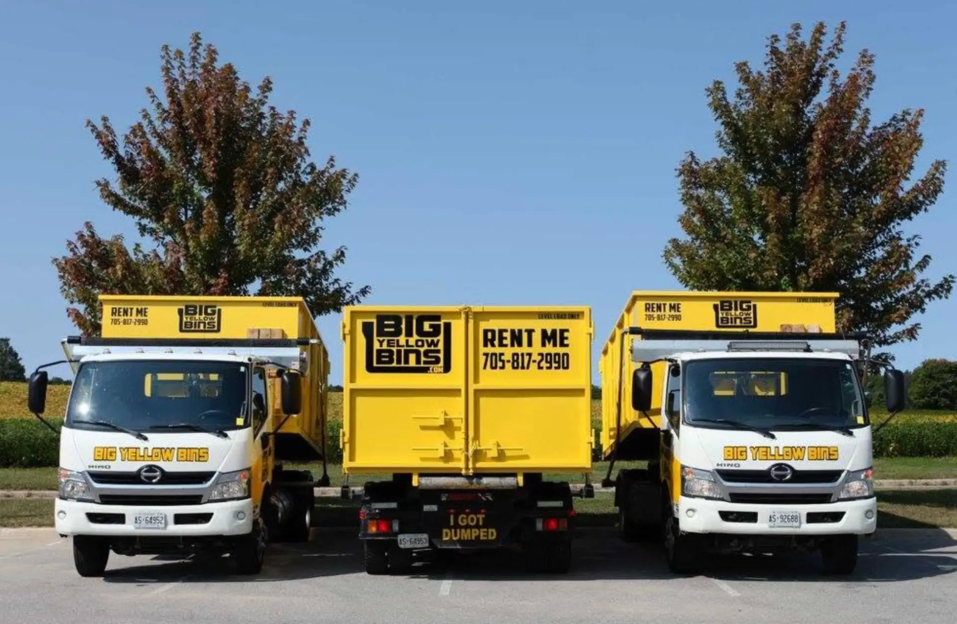 Big Yellow Bins trucks and a 20-yard bin ready for delivery in Simcoe County